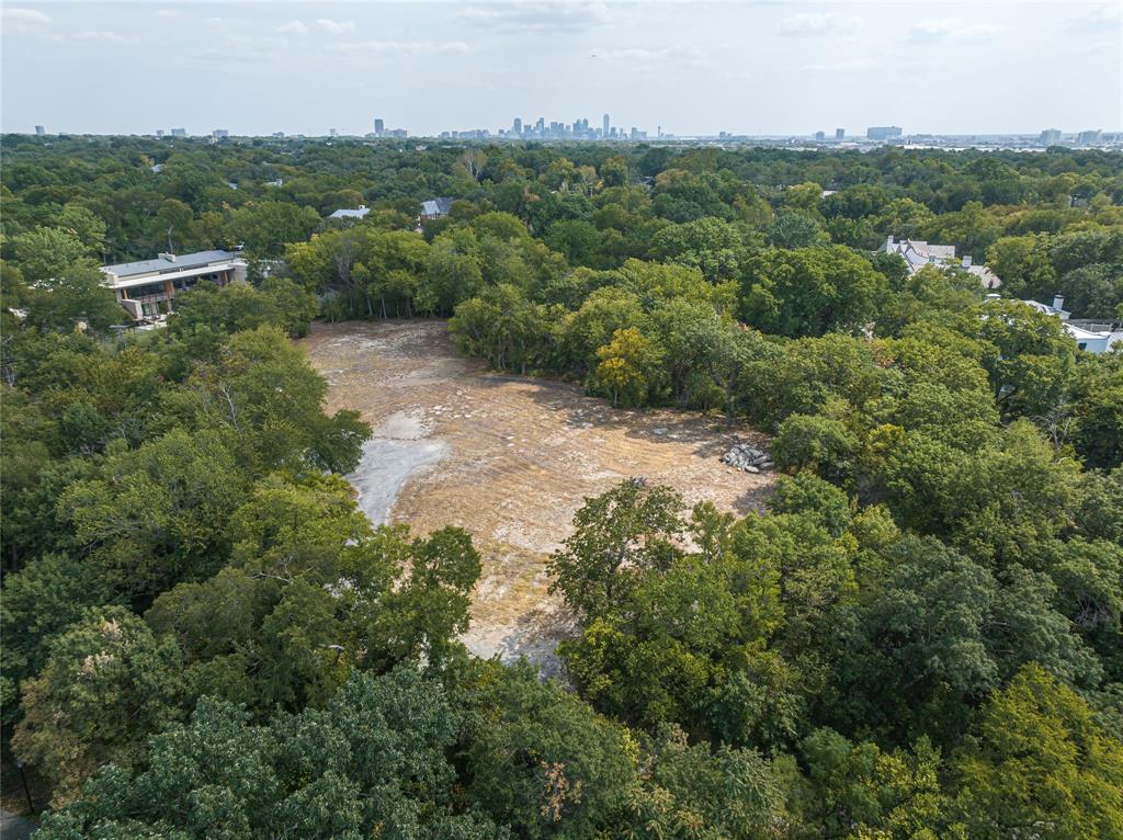 OFFERED WITH 8740 CANYON DR. FOR A 2.14 ACRE BUILDING SITE!  Discover an ideal canvas for the home of your dreams on this 2.141-acre building site combining 8738 Canyon Dr. and 8740 Canyon Dr. in prestigious Bluffview Estates. With the rolling topography and a canopy of mature trees creating unparalleled privacy, this land is the perfect location for a marquis, legacy estate home. This highly desirable location offers both tranquility and convenience, a rare combination. Take advantage of the lush surroundings and blend nature and architecture into a one-of-a-kind home in the heart of Dallas!  Surveys located in the Transaction Desk.  Don't miss seeing this special site.