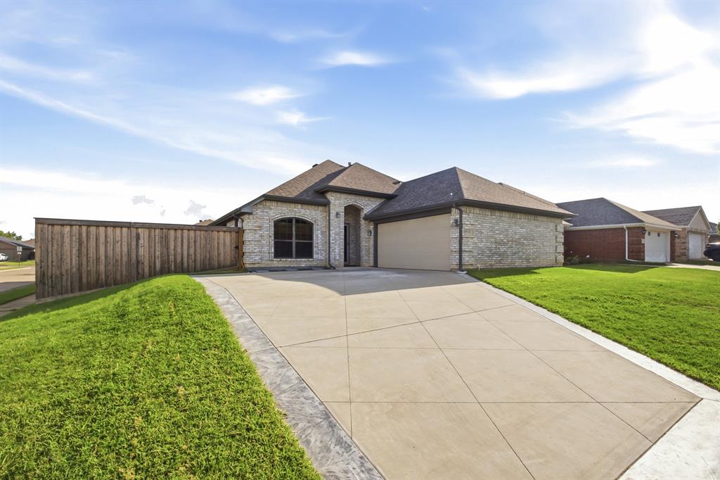 Welcome to 9101 Autumn Falls Drive, a beautifully maintained corner-lot home located in Fort Worth and zoned to HEB ISD! Offering 3 spacious bedrooms and 2 full bathrooms, this inviting residence combines comfort, functionality, and an exceptional location. Nestled on a quiet street with an elementary school just a short walk away, it's the perfect place to call home. Inside, you'll find a bright, open-concept floorplan designed for both everyday living and entertaining. The spacious family room features a cozy corner electric fireplace, while the well-appointed kitchen offers a breakfast bar, abundant cabinetry, and plenty of workspace. The private split primary suite serves as a relaxing retreat with dual vanities, a garden tub, separate shower, and a large walk-in closet. Generously sized secondary bedrooms provide flexibility for family, guests, or a home office. Additional conveniences include a utility room with built-in cabinets, a 2-car garage, and a spacious backyard complete with a sprinkler system, offering plenty of room for outdoor entertaining, gardening, or play. This lovingly cared-for home is truly move-in ready and waiting for you!