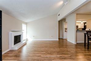 INVEST NOW - BELOW MARKET PRICE  Adorable and Delightful with Amazing Updates! Top-Notch Amenities and Prime Dallas Location! Move in ready luxury with updates that include granite counters in kitchen, white cabinets, subway tile, laminate floors & Low E vinyl windows. Fridge will stay with unit. 2-bedroom 2 bath on the 2nd floor, corner unit boasts lots of natural light.  For your benefit, the hall closet has been outfitted for a stackable washer-dryer. Large living room with vaulted ceiling & wood burning fireplace give you plenty of room to relax or entertain your friends and family. Open concept floor plan allows dining area open to kitchen & living. Covered parking space in center parking lot- entrance off of Midway. Complex has 2 pools & 5 laundry facilities. Convenient access to premier shopping and dining. Easy access to 635, Tollway, Galleria, restaurants, and shopping. Perfect Location for you!