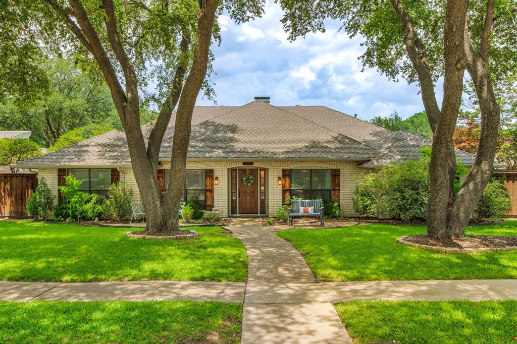 Welcome to this BEAUTIFULLY REDESIGNED ranch-style home in highly sought-after Prairie Creek Meadows—a true down-to-the-studs renovation where every detail has been thoughtfully selected. Just steps from Prairie Creek Park, this exceptional home offers 4 bedrooms, 3 full baths, and a highly desirable open-concept and split-bedroom floor plan. From the moment you enter, exquisite custom millwork in the foyer and dining room creates a lasting first impression, while rich wood flooring flows throughout the main living areas. Timeless design details and custom finishes add warmth and character. The chef’s kitchen is truly extraordinary. An oversized island, quartz countertops, and a premium suite of KitchenAid appliances—including a gas cooktop, double ovens, warming drawer, microwave, and wine refrigerator. Additional custom cabinetry provides valuable counter space and storage, making it the perfect spot for a morning coffee station, dry bar, or serving area - perfect when entertaining family & friends. The spacious living room is anchored by a stunning fireplace, creating another natural gathering place. The private primary suite features a spa-inspired bath with dual vanities, oversized walk-in shower, and a freestanding soaking tub designed for ultimate relaxation. With privacy in mind, the split-bedroom floor plan includes a private haven, complete with a bathroom, making it perfect for guests, extended family, or a flexible living arrangement.  The second living area showcases walls of windows that flood the space with natural light and views of the sparkling pool. A covered patio, turfed yard, and flexible side yard make this outdoor space as functional as it is inviting. UPDATES & FEATURES: Windows; Plant Shutters; Wd Floors; Custom Millwork; PVC Plumbing; Furnaces '22; Roof '17; Covered Patio '21. This is the one you've been waiting for — beautiful, move-in ready, and just waiting for the next lucky family!