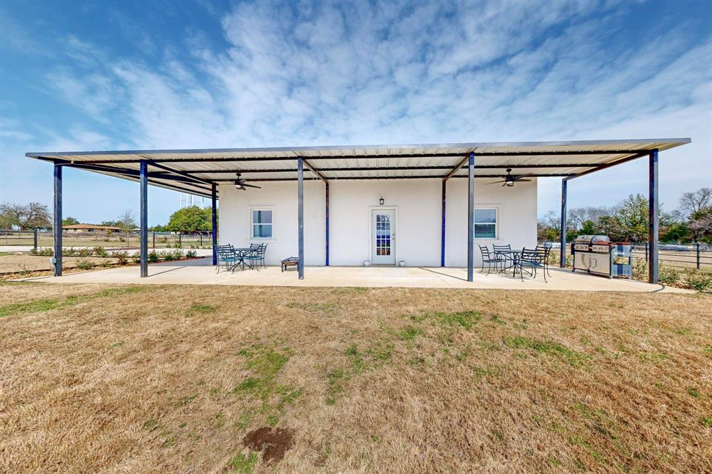 Amazing one of a kind property with no HOA and over 12 acres of land , 2 bedroom and 1 bath stucco siding barndominium with attached garage or shop . This property is less the one hour drive from Dallas .  By the gate you have a pad site for your RV or tiny home .   The barn has water for your animals along with 3 ponds and a 45 foot well .  Inside this cozy home its move in ready with a tankless hot water and spray foam insulation .  The main pond was dug out to approximately 30 feet .  The possibilities are endless , come use your imagination