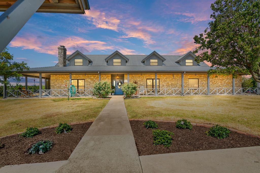 Rare opportunity to own 72+ acres of country paradise situated between Walnut Creek and Little Walnut Creek with post-card-like views. Completely remodeled and added the entire 2nd floor in 2019, this custom rock home with a metal roof has it all! A few of the updates include all flooring, HVAC, all kitchen appliances, 4 stalls built in barn, chipseal driveway, and enclosed and screened-in back porch. Additionally, the entire upstairs was converted to include 2 bedrooms, a full bath, and an office. The property features full wrap-around porches, custom pipe and no-climb fence around the yard, storm cellar with electricity. One-of-a-kind property with established coastal hay production, 3,000sf insulated garage-workshop with electricity, water, and 14' tall doors, and interior of barn remodeled and exterior working pens. You have to see it to appreciate all love that has been put into this picturesque property!