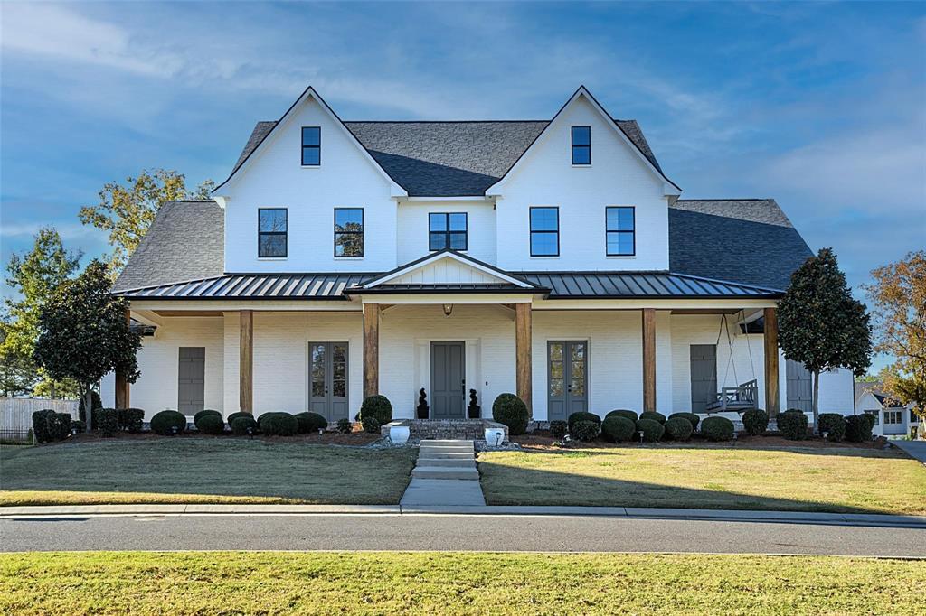 Welcome home to this beautiful modern farmhouse in the prestigious, gated Southern Trace community. With over 5,000 sq ft of thoughtfully designed living space, this property blends timeless style with modern comfort and amenities. Featuring 5 bedrooms and 5 and a half baths, this home offers an open concept layout ideal for entertaining and everyday living. Step inside to find soaring ceilings, abundant natural light and beauty throughout. Grab a book and enjoy the reading nook, or step across the way and get your work done in the cozy office. Each bedroom has its own ensuite bathroom. During the warm summer months, cool off in the pool or sit under the covered patio. Located in one of Shreveport's most sought after gated neighborhoods of Southern Trace, enjoy guarded entrances, plus access to unmatched community amenities including a pool, golf course, tennis courts, pickleball, clubhouse, dining facilities, and a park with playground. Don't miss this one!