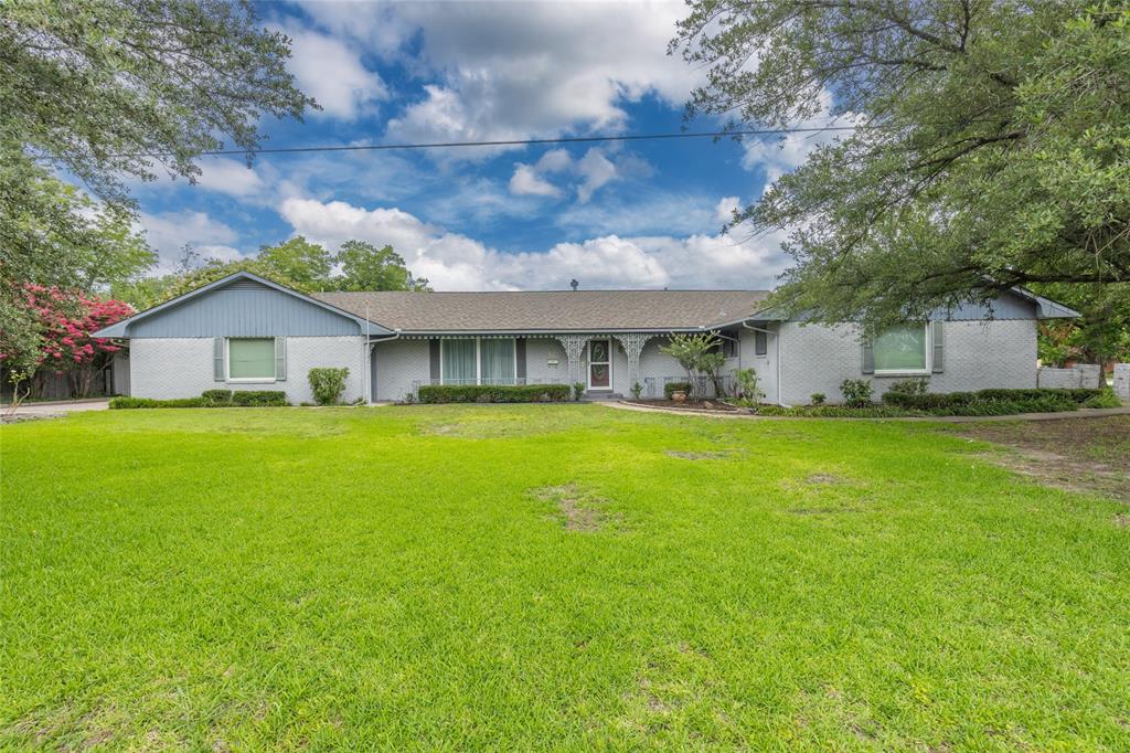 Price Reduced - Bring Offers! Spacious 3 bedroom, 3 bath mid-century modern home with over 2,900 sq ft.
Two large living areas and two dining areas for flexible living and entertaining. Built-ins and fireplaces add character.
Covered patio with built-in grill and sink, hot tub, waterfall and pond. Detached workshop with electricity.
Lots of home for the money.