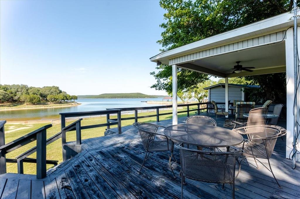 Nestled in an ideal lakefront location overlooking the peaceful cove, this beautiful property offers the perfect blend of relaxation and community living. Enjoy stunning water views from the spacious covered porch, the perfect spot for morning coffee, evening sunsets, or entertaining guests year round. With a setting that captures both privacy and natural beauty, this home is located in a highly desirable community known for its welcoming atmosphere and exceptional surroundings. Whether you’re seeking a full time residence or a weekend retreat, this property delivers the best of lakeside living. Leasehold land, price TBD.  Home is sold furnished, less personal items.