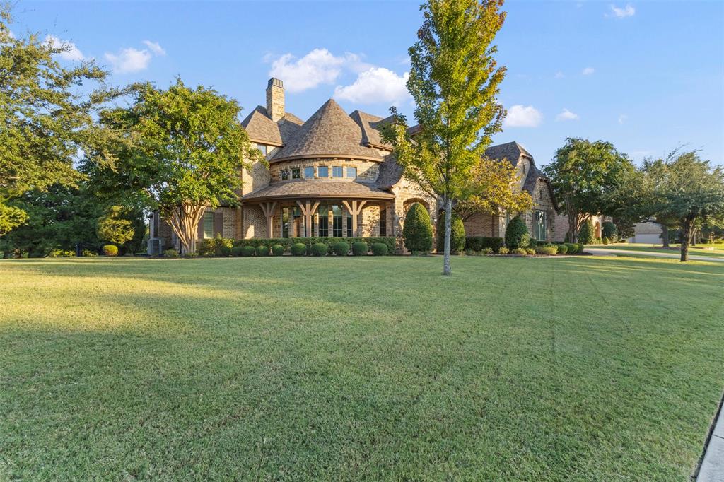 Welcome to 1025 Cedar Glen Trail in the highly sought-after community of Heath, Texas where privacy, space, and refined design come together on a beautifully treed 1-acre lot just minutes from Lake Ray Hubbard.

This custom home has been recently refreshed with all new interior paint colors, creating a clean and modern feel that complements the timeless craftsmanship throughout. From the moment you enter, you will notice soaring ceilings, extensive hand-scraped hardwood flooring, and detailed stonework that add warmth and character to the home.

The chef’s kitchen is built for both everyday living and entertaining, featuring a large center island, double ovens, built-in side-by-side refrigerator, and stainless steel appliances, all opening seamlessly to the main living areas.

Step outside to a true backyard retreat designed for Texas living. Enjoy a sparkling pool, expansive covered patio, and fully equipped outdoor kitchen, ideal for hosting and relaxing year-round. The fenced yard, mature landscaping, and full sprinkler system provide both beauty and functionality.

The private study offers incredible natural light with wraparound windows, creating a perfect work-from-home or flex space.

Additional highlights include granite countertops throughout, a welcoming front porch, and thoughtful custom details at every turn. Located in a desirable Heath neighborhood near the lake, this property offers the rare combination of space, luxury, and convenience.

Homes with this level of finish, recent updates, and one-acre setting in Heath are hard to find. Schedule your private showing today.