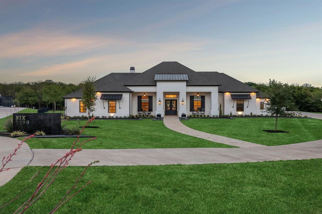 Welcome to one of the most pristine estates in Heath Crossing. 600 Chatham Hill in Heath, TX is a 5,500+sf single-story is situated on a 2+ acre cul-de-sac lot that abuts a tree-lined creek, creating the perfect blend of space and privacy. The interior of this home offers four large bedrooms all with ensuite full bathrooms, a bunk room with four built-in bunkbeds, a dedicated office, spacious main living areas, an oversized laundry room, an oversized butler's pantry, full-sized wet bar with adjoining den, and an additional flex space that can be used either as an exercise room, guest room, or additional office space. Inside you will also find wide-plank white oak hardwoods in all non-wet areas, towering cathedral ceilings, tremendous natural light, multiple interior brick accent walls, solid core doors, and so much more. The kitchen includes gorgeous quartzite countertops and matching backsplash, adjoining butler's pantry, built-in SS refrigerator and freezer, two sinks, an eat-in island, and a commercial grade gas WOLF range with double ovens. In addition to the inside features, 600 Chatham Hill also has an oversized 4-car garage, covered outdoor living and kitchen areas, a pool and spa with diving board and recently added slide, a, in-ground trampoline, and a recently remodeled back fire pit area with built in porch swings. This may be one of the most thoughtfully and tastefully designed homes you have ever seen. Please contact the listing agent for more information or to setup a showing.