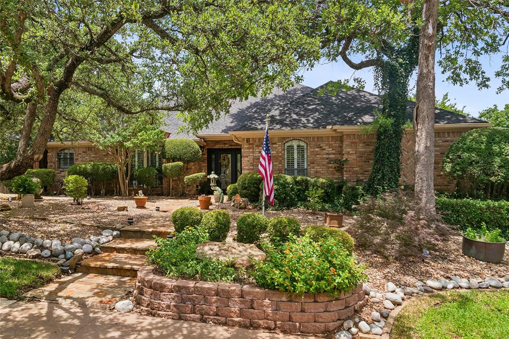 Beautifully maintained custom-built home in a highly desirable Bedford neighborhood. This property features a low-maintenance landscaped yard, sparkling pool with spa and fountain, and a separate workshop or 'man-cave' complete with electricity and air conditioning. Inside, pride of ownership shows throughout. Both living areas share a see-through fireplace, creating a warm and inviting flow. The spacious primary suite includes its own fireplace and sitting area. Enjoy outdoor living under the covered patio, perfect for relaxing or entertaining.
