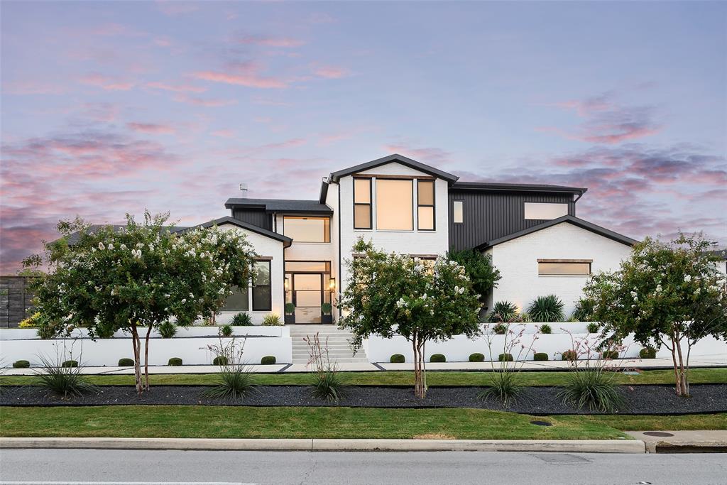Set on an elevated lot with circle drive in Preston Hollow, this ARK Studio designed home was completed by Third Street Custom Homes circa 2021 blending modern elegance and effortless comfort.  The light-filled transitional residence spans 4,984 sqft and is designed for both grand entertaining and everyday living. Wide-plank hardwoods, Porcelanosa tile, soaring ceilings, and walls of glass set the stage for designer finishes, thoughtful upgrades and deft execution throughout. Step into the dramatic living room, where 24-foot ceilings and a sleek gas fireplace are framed by sliding glass doors that open to a 560 sq. ft. screened patio, resort-style pool, fire pit, and turfed backyard. The dining room, complete with a wet bar and wine fridge, flows seamlessly into the chef’s kitchen—an entertainer’s dream featuring a large island with breakfast bar, Dacor 6-burner gas range, Monogram microwave and dishwasher, double ovens, Signature Kitchen Suite refrigerator and freezer, trash compactor, and an oversized walk-in pantry with a Whirlpool refrigerator and freezer combo. The primary suite is a private retreat with an updated spa-like bath and a custom walk-in closet that includes direct access to the utility room with sink. Additional first-floor amenities include a guest suite, private study, media room with built-ins and bar, family room, mudroom, and a full bath perfectly positioned for poolside guests. Upstairs, two spacious bedrooms with en suite baths and generous storage offer comfort and privacy. A three-car garage with additional half-circle drive, storm shelter, lush landscaping, and custom motorized shades throughout complete this truly turnkey property. Seamlessly balancing luxury, function, and style, this home is as practical as it is breathtaking - ready to elevate daily living into something extraordinary – all set in one of Dallas’ most sought-after neighborhoods - close to Dallas’ top schools, shopping and dining.