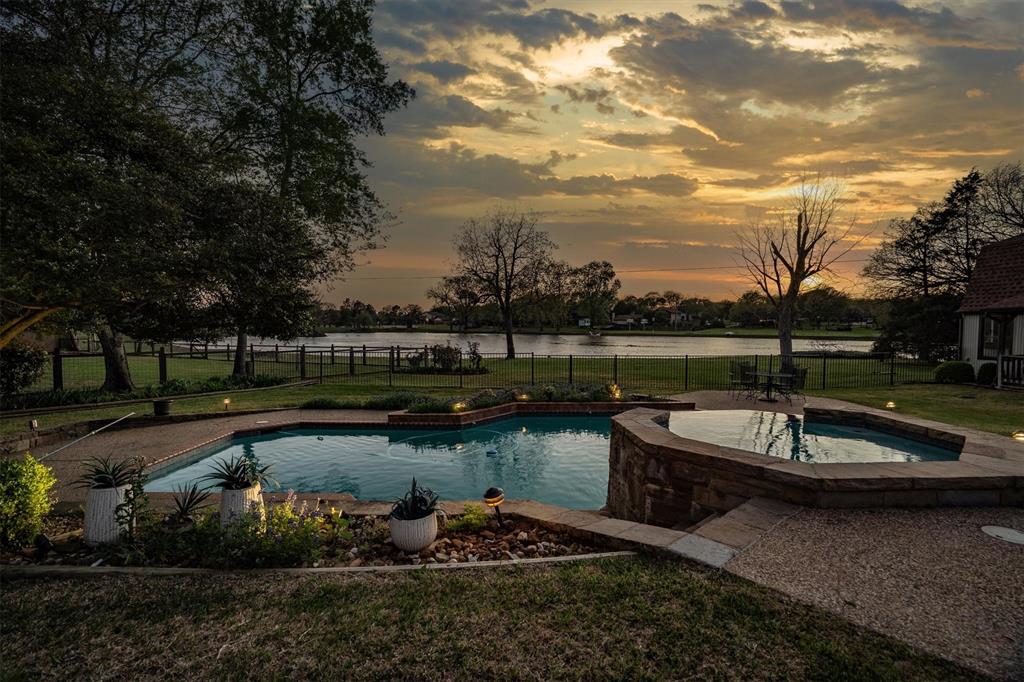 Tucked away on nearly one acre and backing to a serene 5-acre pond, this exceptional property offers a rare opportunity to own one of the few homes with direct water views in highly sought-after Double Oak. With a total estimated 3,194 square feet, including a thoughtfully designed main residence and versatile flex space, this property blends comfort, functionality, and potential.
The property features 5 bedrooms, 4 full bathrooms, and a spacious 3-car garage with additional room for a workbench or storage. Inside, you’ll find timeless features including a wood-burning fireplace, built-in bookshelves in the formal living area, central vacuum system, attic fan, and updated windows that enhance both efficiency and natural light.
The detached shop adds a unique dimension to the property, offering the 5th bedroom and an air-conditioned upstairs flex space complete with a bathroom—ideal for a guest suite, private office, or creative studio. The downstairs shop presents additional opportunity and could be finished out to create more living space with the addition of a mini-split system, increasing the overall square footage.
Step outside to enjoy a true backyard retreat featuring a diving pool, covered patio, and expansive deck overlooking the tranquil pond. Whether hosting gatherings or enjoying quiet mornings, the setting delivers unmatched views and a peaceful atmosphere rarely available in this area.
Ample storage throughout the property and flexible spaces provide endless possibilities for customization. With solid bones and room for personal vision, this home presents a unique chance to create a truly remarkable estate.
Homes on this pond seldom come to market—don’t miss the opportunity to secure this private oasis.