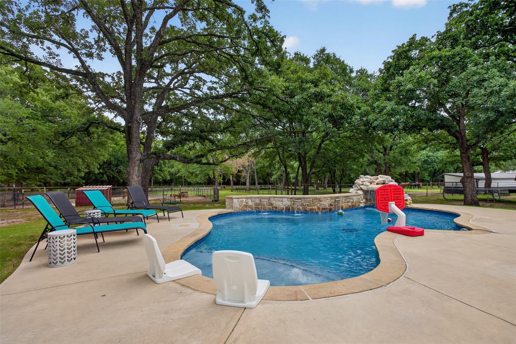 Welcome to your private Texas retreat in Scurry Texas! Nestled on a spacious homesite, this beautifully updated property offers the perfect blend of country living and modern comfort with an impressive list of recent upgrades that make it truly move-in ready. Home offers over 3 acres with mature trees, beautiful pool, fencing, pond, covered patio, 36 by 12 three horse run with attached 6 by 12 tack room and a 26 by 36 barn with 4 bay doors and electricity. 

From the moment you arrive, you'll notice the enhanced curb appeal featuring a long driveway, updated exterior finishes, and new gutters. Step inside to discover fresh flooring throughout, a remodeled kitchen designed for both everyday living and entertaining, and a newer HVAC system providing year-round comfort and efficiency. Cleaning is easier with a whole home central vacuum system.

The backyard is where this property truly shines. Imagine spending summer days lounging by your stunning new pool, hosting gatherings on the expanded covered patio, or unwinding after a long day under the Texas stars. Whether you're entertaining family and friends or simply enjoying peaceful country evenings, this outdoor oasis delivers.

Properties with this level of care, upgrades, and outdoor amenities are hard to find. If you've been searching for a home that combines modern updates, functional space, and resort-style outdoor living, this is one you won't want to miss.

Schedule your private showing today and experience everything this exceptional Scurry property has to offer!