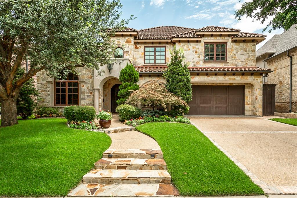 Tuscan-inspired custom luxury residence built by Blanchard Homes, blending timeless Old World architecture with exceptional modern convenience. This impressive two-story estate offers 4 bedrooms, 5 full baths, private elevator access, multiple indoor and outdoor entertaining spaces, and resort-style amenities throughout. A dramatic entry welcomes you with a sweeping wrought iron staircase, soaring ceilings, and rich architectural detailing that carry throughout the home. Designed for both everyday living and grand entertaining, the floorplan features a formal dining room, private office, expansive game room, dedicated media room, and three fireplaces creating warmth and character throughout the home. The chef’s kitchen is exceptionally appointed with a sub-zero refrigerator, commercial-grade gas range with pot filler, double dishwashers, double ovens, warming drawer, oversized center island, dual prep sink stations, butler’s pantry, and two walk-in pantry spaces. The first-floor primary suite serves as a private retreat with a truly unique dual-bath configuration, offering exceptional privacy and luxury. Each side includes its own vanity, sink, custom built-ins, and walk-in closet, anchored by a shared spa-inspired space featuring a raised jetted soaking tub and oversized walk-in shower with rain head. Upstairs living spaces offer flexibility for entertaining, recreation, and guests, while the richly appointed game room with custom wood paneling and wet bar creates a standout destination. Outdoor living is equally impressive, with two covered entertaining areas, outdoor fireplace, built-in grill, resort-style pool and spa, mosquito misting system, and beautifully integrated Mediterranean-inspired hardscaping. Additional premium features include a Generac natural gas backup generator, elevator, abundant custom cabinetry, extensive stonework, and exceptional craftsmanship throughout.
