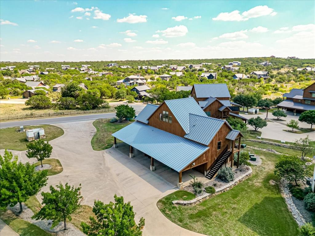 Feel the energy of summer and answer the call of Possum Kingdom Lake in this luxurious Harbor carriage house designed for carefree lake living. This beautifully appointed two-bedroom, loft, two-bath residence delivers the ultimate lock-and-leave lifestyle with upscale comfort, vibrant resort-style amenities, and breathtaking views that set the tone for unforgettable weekends and endless summer memories.
Natural light fills the spacious open-concept living area, creating an inviting atmosphere perfect for entertaining after a day on the water. The modern kitchen features upgraded appliances, generous counter space, and seamless flow for gathering with family and friends. Both bedrooms are thoughtfully positioned for privacy and relaxation, while the versatile upstairs loft offers additional sleeping space, a home office, or flex retreat for guests.
Step onto the oversized balcony and soak in panoramic lake and sunset views while enjoying the fresh summer breeze. Two attached garages provide exceptional storage for vehicles, golf carts, and lake toys, making every adventure effortless. Residents enjoy exclusive access to The Harbor’s premier amenities including resort-style pools, fitness center, marina, walking trails, sports courts, and upscale dining.
Whether you are searching for a full-time residence, luxury vacation escape, or income-producing lake property, this Harbor carriage house captures the elevated lifestyle and unmatched beauty of Possum Kingdom Lake. Summer is here, lake life is calling, and this is your opportunity to enjoy it in style.