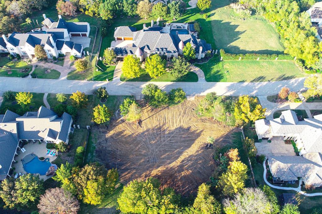 Discover the perfect canvas for your dream home on this stunning 1.0032 Acre homesite, nestled within the vibrant community of Southlake. This fabulous flat interior lot, adorned with gorgeous mature trees, is located in The Enclave, a prestigious subdivision boasting 13 custom estates, each on over 1-acre sites. Situated in a charming cul-de-sac, this homesite offers the freedom to partner with your own Custom Builder and the major benefit of not having to wait on others to finish building around you. Centrally located in Carroll ISD, this prime location provides quick access to the area's best shopping, restaurants, and amenities. Zoning approval has already been completed, and all utilities, including city water, sewer, and gas, are conveniently available on the street. With everything in place, it's time to dust off those plans and start building your vision of home today!