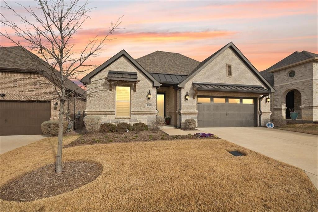 Would you like to enjoy a low maintenance, Lock-N-Leave Lifestyle? Ladera at the Reserve is a gated 55+ Community in Mansfield offering amenities such as Community pool, Fitness Center, Greenbelt, Walking paths, Pickle Ball Courts and a Club House. Monthly newsletter informs you of social events to attend. 2503 Nueva Way was designed with details in mind. First stunning item noticed upon entry is the beautiful ceiling wood beams. Living room offers built-ins, gas fireplace and a tri-panel door that fully opens to your private patio overlooking the pond. Beautiful Navy Cabinets compliment the colors in the Quartz countertops and the island offers extra seating. Enjoy cooking on the 5 Burner gas range or baking in the double oven & Butler Pantry offers a wine fridge and even more storage and functionality for hosting guests. Both Living and Kitchen are open to the Dining Room, several conversation areas. True study-flex room with French doors.Primary suite offers a stand alone tub and detailed tile work in the seamless glass shower is impressive. Walk-in closet for plenty of storage, dual vanities, and solar tube for extra natural light. Secondary Guest bedroom has access to its own private full bath offering detailed tile in tub shower combo and upgraded flooring. Gain access to the utility room through the rich stained sliding wood door. Fun Surprise in utility is a custom designed dog wash, space also plumbed for another sink if you choose to add one. Transient glass offers more natural light. Few more details not found in standard builds currently:Mud room, Shutters on every window, automatic shades over the Tri Fold Doors, Floor plugs, USB plugs in outlets, auto closet lights, Surround Sound in home and patio, Upgraded outlets where needed for TV's and outside decor, Central Vac System, Under cabinet lighting, and surge protector covers the entire home. FOAM INSULATED for energy efficiency.