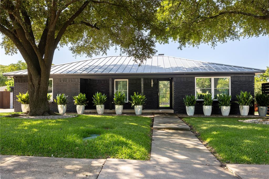 Stunning Lochwood retreat offering 4 bedrooms, 4 bathrooms, and over 3,100 square feet of beautifully updated living space. Designed for both everyday living and entertaining, this home features an open-concept floor plan with multiple living areas, wood flooring throughout, and a beautifully remodeled kitchen with extensive 2020 updates, including a Wolf cooktop, Wolf microwave-speed oven, Wolf Vent-A-Hood, Wolf double ovens, and Cove dishwasher. Major 2020 improvements also include a Class 4 metal roof, high-efficiency dual-zone variable-speed HVAC systems with all new ductwork, and tankless water heater. The oversized enclosed two-car carport features a new garage door, automatic garage door opener, and an EV charger, all installed in 2020. Step outside to your private resort-style backyard featuring a diving pool, sauna, lush landscaping, and multiple outdoor living spaces perfect for relaxing or entertaining. Pool equipment was updated in 2025 (excluding the blower and heater), while the pool heater was replaced in 2020. Ideally situated just minutes from White Rock Lake, the Dallas Arboretum, premier shopping, dining, and convenient access to major highways.