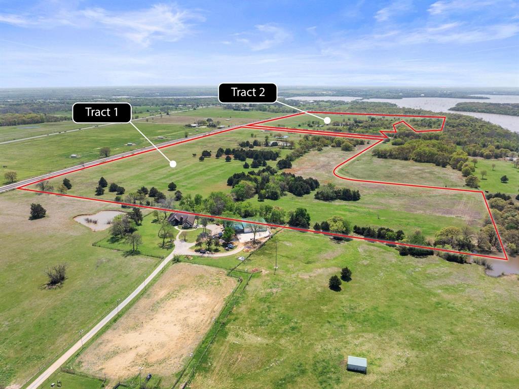 Rare opportunity to purchase a large acreage tract with over 3200 feet of Corps of Engineer frontage and seven ponds. The land is absolutely gorgeous with the perfect balance of cleared pasture, wooded areas, and mature oak trees.  With over 1100 feet of frontage on two sides of Hog Town Road, the possibilities are endless. The property is ideally situated between Tioga and Collinsville, just one quarter mile West of Highway 377.  The sandy loam soil and coastal bermuda make this property ideal for cattle or horses. Bring your own builder and build your dream home or hold the property as investment while you enjoy the recreational benefits.  Excellent opportunity for an outdoor enthusiast that loves to hunt, fish, or go for evening rides on the ATV. Grayson County Electric is currently being delivered to the property. The city of Collinsville has a water line on Hog Town Road to the East of this property. The property is fully fenced with a current ag exemption in place. Grayson County development services has verified that the frontage on Hog Town Road is a public right of way, which provides an opportunity for future subdividing. This property is also listed as two smaller parcels, see MLS number 21144229 and 21144233.