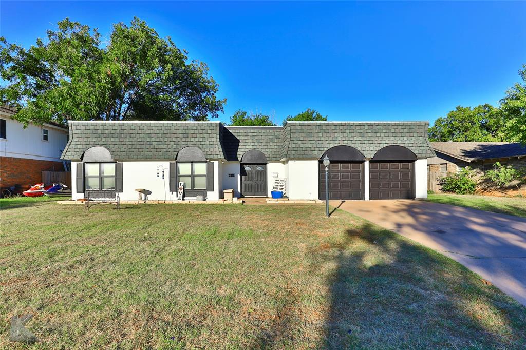 This stunning home is a rare find! Situated in a prime location close to Red Bud Park, this property offers 4 bedrooms, 3 bathrooms, 2 living areas, & numerous attractive features. Step inside & discover 2 primary suites, each with its own private bathroom, ideal for multi-generational living or guest accommodations. You'll love the recent updates, including brand new Luxury Vinyl Plank flooring throughout, completed in 2023. The modern LVP not only enhances the aesthetic but also makes maintenance a breeze. The exterior showcases a stylish Mansard Roof in the front, installed in 2022, along with a durable metal pitched roof in the back, ensuring protections & longevity. Cozy up by the fireplace in the living area, perfect for those chilly evenings. This home offers both comfort & style. With its unbeatable location near Red Bud Park, this property is a true gem. Don't miss your chance to make it your own. Schedule a showing today!