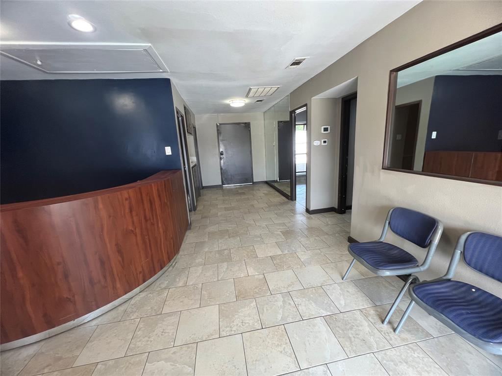 This building has 6 semi-private offices and a large multi-purpose space on the opposite side. There is a reception area with a desk, sitting and waiting area, common area sink and two private restrooms. The 6 offices are on either side of a hallway: 3 offices connect to each other; the other 3 offices have a glass window or door to another office. On the other side of the reception you will find a HUGE room, which can be used as an open office, semi-private cubicles, storage space or showroom. It has a wide, almost wall-to-wall mirror, which makes the room optimum for a dance studio. There is a closet space and a warehouse with shelves. There is ample parking for your customers in the front and side and fenced, covered parking for employees in the back. The back parking also serves as a receiving area for deliveries.

The building sits at an ideal location between a residential area and Broadway Blvd., full of retail, restaurants, churches, medical and dentist offices and Walmart.