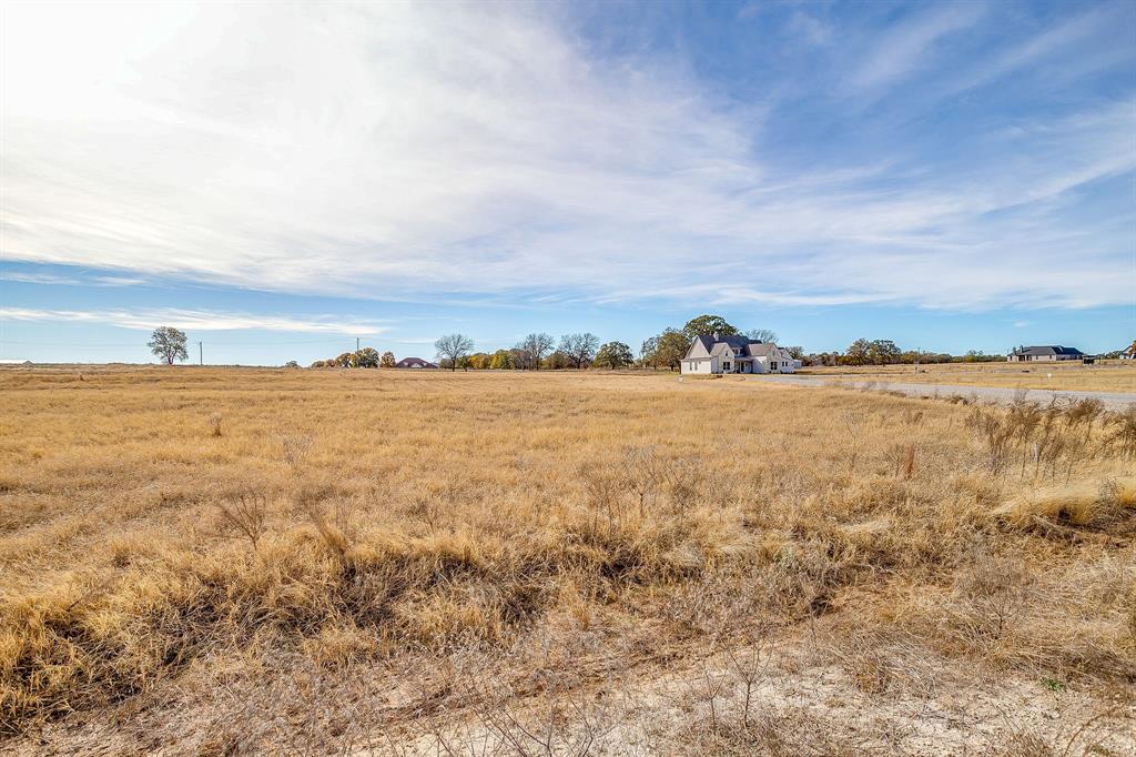 Sitting on a spacious 2 acre lot you'll enjoy peaceful country living with no HOA, no city taxes and no water bills! Located in a highly rated school district and less than an hour from Fort Worth, this home offers the best of both worlds, quiet country charm with easy access to the city. This one is move in ready and waiting for it's new owners 

Bring your own builder- or sit on it, use our builders…all options for these lots. No minimum time to have it built.