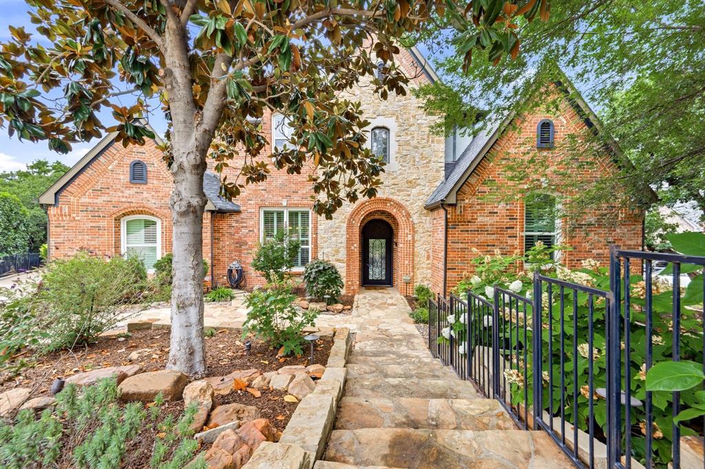 3091 Whispering Oaks blends timeless architecture with modern luxury upgrades in a setting that feels worlds away from the city while remaining close to everything. The heart of the home is the fully renovated kitchen, thoughtfully designed with modern high end appliances, generous prep space, abundant cabinetry, and seamless flow into the main living and entertaining areas. The open layout creates effortless functionality with unobstructed outdoor views serving as the backdrop. A lounge room elevates entertaining with a striking backlit onyx bar wall, and direct access to the outdoor patio and pool areas. The spacious family room features expansive windows blurring the line between indoor and outdoor living. The primary suite offers a true private retreat with spa-inspired bath amenities, oversized walk-in shower with water wall creating a tranquil space, custom closet designed for storage and organization plus a cedar closet. Two secondary bedrooms include ensuite bath access, creating privacy and comfort for family and guests alike.  Two guest rooms share a jack and jill style bath with separate vanities and shared wet area, both with walk in closets, and feature seasonal water views. Upstairs, the oversized media room creates the ultimate destination for movie nights, sports events, and entertaining. Theatre can be fully equipped (with acceptable offer) including projector, screen, sound system and theater style multi-positional seating for eight. Outdoors, the property transforms into a private vacation retreat. The resort-style double pool with its dramatic waterfall feature becomes the centerpiece of the backyard, surrounded by lush gardens, manicured landscaping, covered entertaining areas, multiple seating areas, outdoor cooking area and direct lake access. The elevated balcony deck captures unforgettable sunsets and seasonal water views that change beautifully throughout the day. Energy enhancements include tankless water heater and owned solar panels.