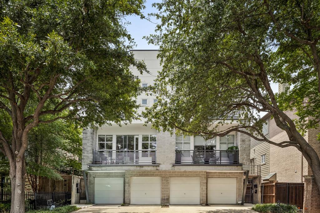 Tucked away on the charming, tree lined Bowser Avenue in Oaklawn, this townhome hits that sweet spot between modern style and easy living. Spread across multiple levels, it’s made for those who love a good get together or just kicking back in comfort. Picture this, a double sided fireplace anchoring the open living and dining areas, coffered ceilings adding architectural interest, designer lighting setting the mood, and built in surround sound for your favorite playlists or movie nights. The kitchen? Total showstopper. Think glass-front cabinets for that perfect mix of display and storage, black granite counters that scream sophistication, and a stainless appliances ready for culinary adventures.The primary suite? It’s your own sanctuary with a private balcony for morning coffee, a cozy fireplace for chilly nights, and a spa like bathroom decked out in designer finishes. Let's not forget the crown jewel, a roof terrace with jaw dropping city views. Add in zero HOA dues, and you’ve got a home that’s as practical as it is stunning.