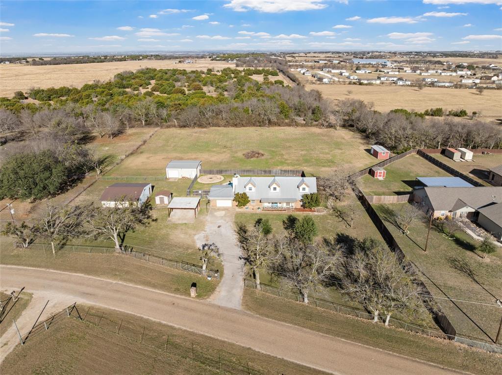 Major Price Improvement! This is your opportunity to own a private Texas retreat on 2.79 fully fenced and gated acres in desirable Lorena, now offered at an incredible new price.

This versatile 2,340 sq. ft. home features 4 bedrooms, 2 bathrooms, and a dedicated office, offering plenty of space for everyday living, working from home, or creating the flex space you’ve been looking for. The kitchen is equipped with granite countertops, stainless steel appliances, a brand-new dishwasher, and a refrigerator that conveys.

Important updates have already been completed, including a new HVAC system in 2021 and upstairs windows replaced in 2019, giving buyers added confidence and value.

Outside, you’ll find everything you need to enjoy country living. Cool off in the pool with its fun slide, or take advantage of the impressive barn, shop, and two additional outbuildings all with electricity, providing endless possibilities for hobbies, storage, livestock, equipment, or a home-based business.

With a significant price reduction, this property presents an exceptional opportunity for buyers looking to personalize a home while enjoying acreage, privacy, and outstanding amenities. Whether you choose to move right in or update the home to match your vision, the value is undeniable.

Located just minutes from town, this rare Lorena property offers the space, versatility, and potential that’s becoming harder to find.