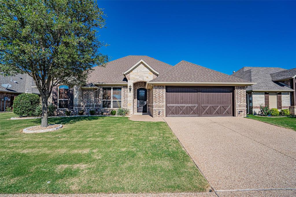 Nice home in the popular Josiah Estates development located just minutes from downtown square, shopping and all that Granbury has to offer. Tile flooring that looks like wood, granite counters throughout, gas log fireplace, and a back yard to die for. Entertain outside with your pool and spa combo that boasts a water feature. Open floor plan with gorgeous cabinets, oversized island with breakfast bar, stools included! Stainless steel appliances and high-end fixtures galore. Large primary suite with echoing ensuite and a walk-in closet fit for royalty. Call today to take a tour! Price includes pool maintenance.
