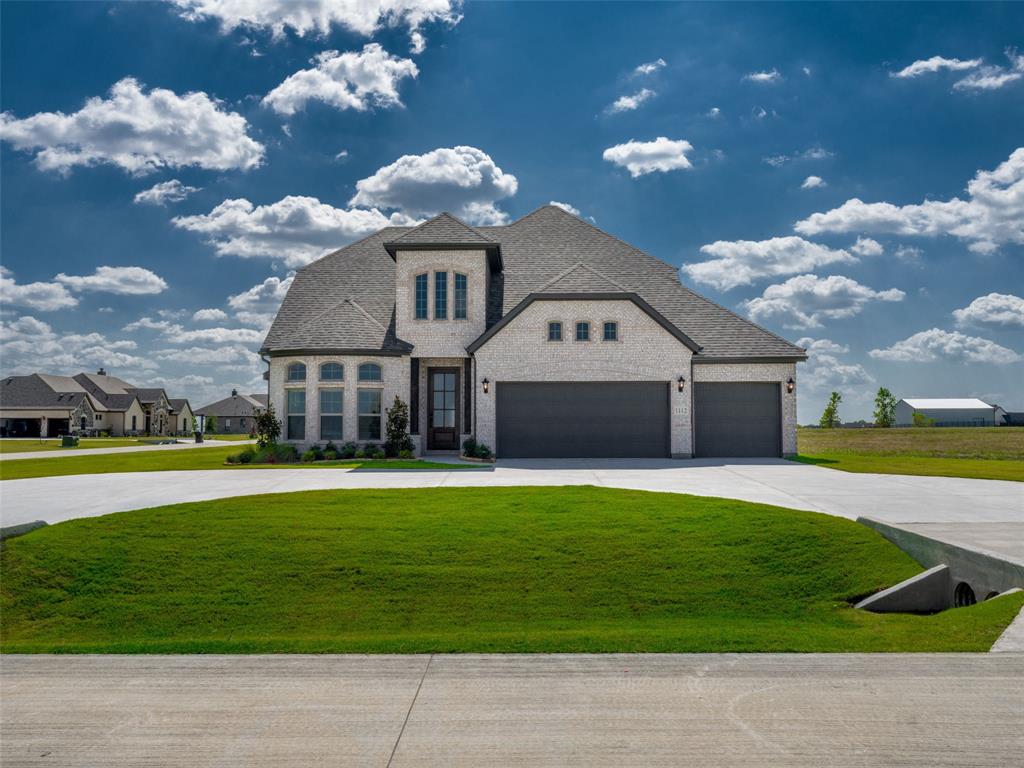 ALMOST LIKE HAVING FOUR PRIMARY SUITES!! This exceptional 4-bedroom residence situated on an oversized acre corner lot with a circular driveway and a 3-car garage. This thoughtfully designed home features two primary suites, each with a luxurious ensuite bath and generous walk-in closets. The open-concept layout includes a gourmet eat-in kitchen with quartz countertops, a wet bar, kitchenette upstairs for the second master, and a spacious living area with a fireplace. Additional highlights include a versatile loft, two secondary bedrooms, and a covered porch ideal for outdoor living. A perfect blend of elegance, functionality, and comfort.
