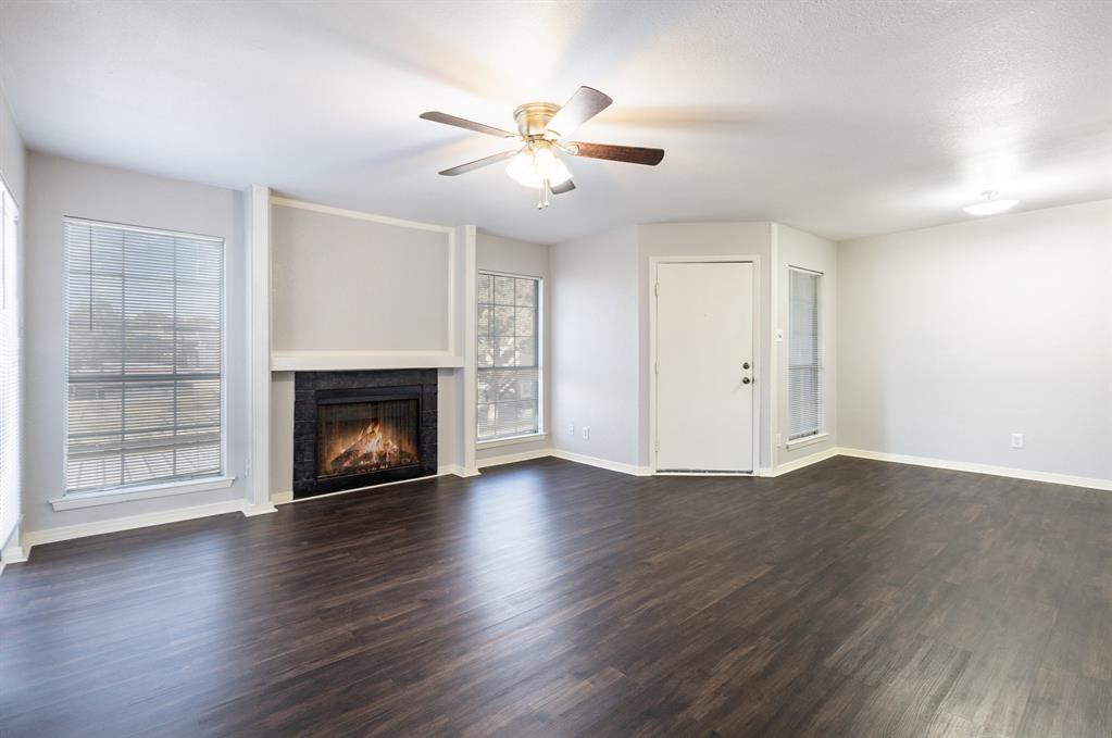 Move-in ready condo in Richardson ISD offering comfort, convenience, and excellent rental potential. This updated second-floor unit features an open-concept layout with laminate wood flooring throughout the living, dining, kitchen, and bedroom areas. The spacious kitchen offers ample cabinet storage and overlooks the inviting living room with a cozy fireplace. Neutral finishes create a bright, versatile space that's ready for your personal touch.

A full-size utility room provides added functionality with extra storage and a folding counter. Recent improvements include a newer HVAC system, water heater, toilet, sink, and tub, while solar screens help improve energy efficiency.

Relax on the covered patio and enjoy the convenience of an assigned covered parking space. Ideally located near Richland College, Lake Highlands High School, shopping, dining, and major highways including I-635 and US-75. Whether you're a first-time buyer, downsizing, or looking to add to your investment portfolio, this low-maintenance condo is a fantastic opportunity