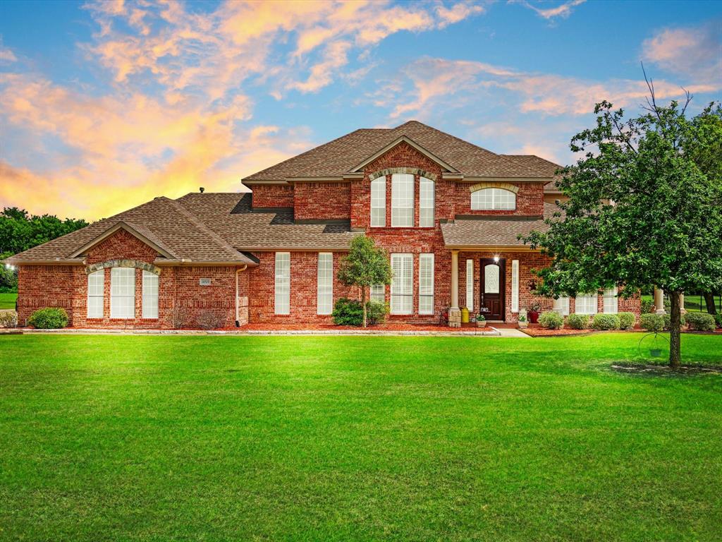 Situated on a beautiful 1-acre homesite in Shamrock Ridge, this exceptional home offers the perfect blend of comfort, functionality, and thoughtful upgrades throughout. Large windows and a cozy fireplace create a warm and inviting living space while providing stunning views of the backyard oasis.
The spacious primary suite is conveniently located downstairs and features abundant windows, private door to the back yard, a large walk-in closet, separate shower, and relaxing jetted garden tub. A dedicated study with built-in shelving and a closet offers flexibility and could easily serve as a fourth bedroom. Upstairs, the game room has been specially insulated for sound, making it an ideal space for entertainment, media, or hobbies.
Designed with efficiency and durability in mind, the home includes extra insulation throughout, radiant barrier protection, foundation piers, two water heaters, three HVAC units, and two attic fans. The 3-car garage is a standout feature, boasting 10' and 18' insulated garage doors, insulated walls and ceiling, 220V service, two ceiling fans, extensive decked attic storage, accessible from the side of the home by an oversized 20’ x 130’ driveway. This quiet south Forney neighborhood is conveniently located less than 5 minutes from I-20, and only 10-15 minutes from retail, dining, and entertainment amenities along Hwy 80.
With quality construction, energy-efficient features, and plenty of space both inside and out, this property is ready to welcome its next owners home.

All information is deemed reliable but is not guaranteed and should be independently verified by the buyer's agent and buyer.