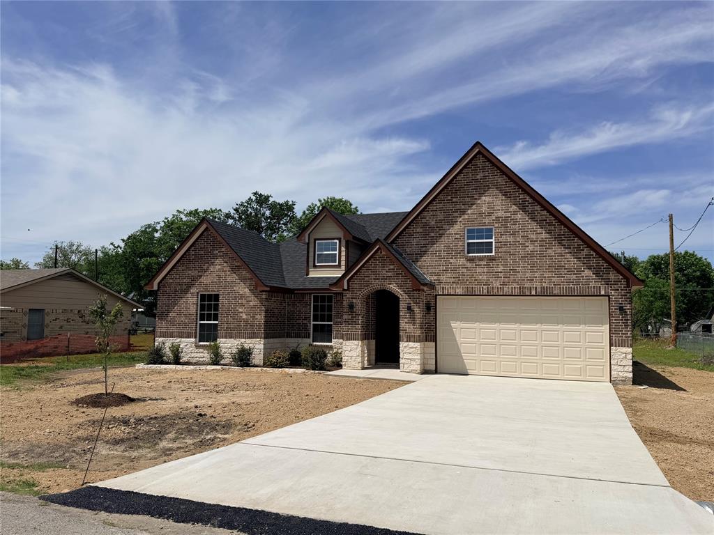 Welcome to the beautiful new build located on .30 of an acre within the small-town charm of Leonard TX. Built by a local builder within a subdivision with no HOA. The property has a rear access easement if needed. The interior features 9-foot-tall ceilings throughout the main areas and vaulted ceilings within the bedrooms, giving a spacious open feel. A combination of Luxury vinyl water resistant flooring in the living area and kitchen, tile in bathrooms, & carpet in the bedrooms and closets. The kitchen offers quartz countertops, a breakfast sitting area and plenty of recess & natural lighting. A large walk-in pantry, an overhead exhaust vent and stainless-steel appliances. As we make our way to the garage, we will find an oversized 8-foot-tall garage door tall enough for the big Texas Trucks. In the attic we will notice the entire house has been fully foam insulated including above the garage to save energy throughout the year.  There are many upgrades to this home.  Come check it out.