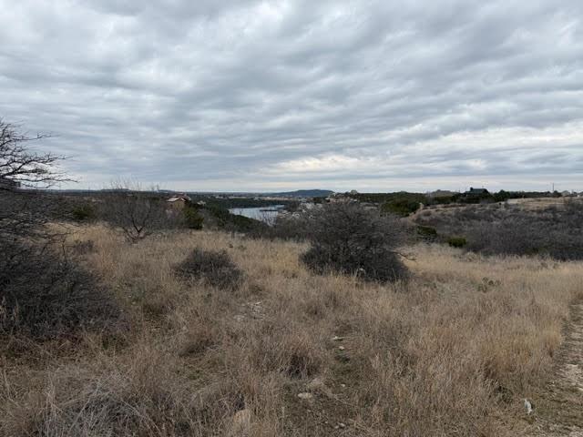 This .22 acre lot overlooks the fairway of hole 14 of The Cliffs Golf Course. Lot ownership entitles owner to 36 rounds of golf per year at The Cliffs as well as access to all of the neighborhood amenities including lakefront area and beach, two swimming pools, tennis courts and playground, discount at Chapparral Grill, marina access and miles of private roads behind the gates.