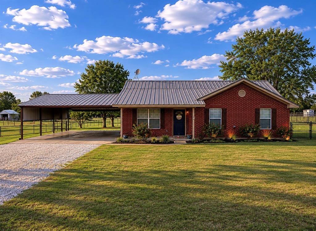 SERIOUS SELLER ISN'T HORSING AROUND-KICKED IN A $10K PRICE CUT! Fully Repainted Inside “Cute as can be” and full of charm, this beautifully updated home offers the perfect blend of comfort, functionality, and country living. Inside, you’ll find fresh painted and updated kitchen and baths, granite countertops, updated appliances, modern lighting and plumbing fixtures, and attractive wood-look laminate flooring throughout the living area, bedrooms, and hallway. Ceramic tile accents the kitchen with Refrigerator Included, baths, and utility room with Washer and Dryer Included, while country-inspired décor adds warmth and character throughout the home.

Enjoy relaxing mornings and peaceful evenings on the covered NORTH FACING front and SOUTH FACING back porches—perfect for rocking chairs and country sunsets. Ceiling fans in the living room and bedrooms provide year-round comfort.

Outside, the property is thoughtfully set up for animals, hobbies, and storage with pipe and wire perimeter fencing, a fenced backyard area for pets or children, and additional fenced pasture space with gates for horses. The impressive 4-car carport offers abundant covered parking, while the workshop barn includes a tack room, overhead roll-up door with separate electric meter, and endless possibilities for horses, projects, storage, or a workshop space. Additional storage sheds add even more convenience.

Like New, Zero Turn Mower, Refrigerator, Washer and Dryer conveys with the property. All information deemed reliable but to be verified by buyer and buyer’s agent.