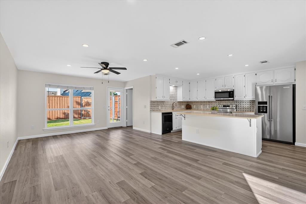 Beautifully remodeled 4-bedroom, 2-bathroom forever home in the highly sought-after Country Meadows neighborhood with NO HOA! Every square inch of this single-story residence was thoughtfully touched during a full renovation, resulting in a move-in-ready gem! Featuring new luxury vinyl plank flooring, fresh carpet, brand-new windows, water heater, updated lighting, and crisp neutral paint throughout. The open-concept kitchen boasts modern finishes and updated appliances overlooking bright, spacious living areas perfect for both daily living and entertaining. The primary suite offers a luxurious walk-in shower with natural stone countertops, while the guest bathroom has been completely upgraded. Outside, the charming German schmear brick exterior provides excellent curb appeal. The large, fully fenced backyard features a tall privacy fence with gated entry — ideal for securely parking a bass boat, camper, RV, trailer, or even storing equipment for a small business. There is ample room to add a shop or pool if desired. Just steps from Country Meadows Park and minutes from Celebration Park, Allen High School, shopping, dining, and US-75, this home offers the perfect blend of peaceful neighborhood living and convenient access to everything Allen has to offer.