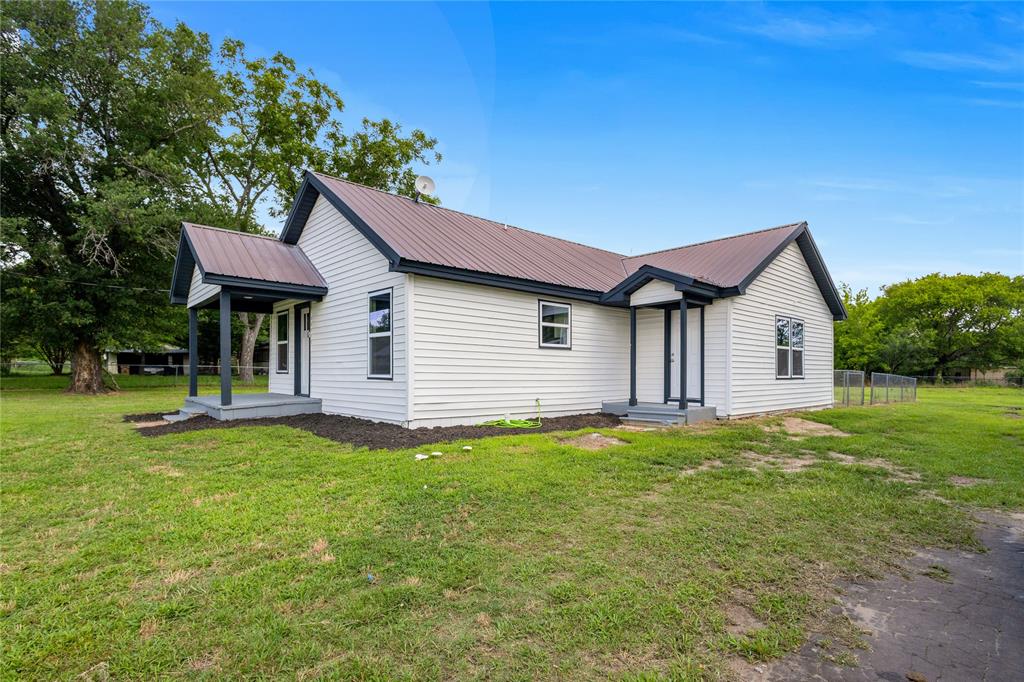 Welcome to your beautifully renovated, move-in-ready haven nestled on an expansive, oversized lot in the heart of Alba! This stunning 3 bedroom, 2 bathroom home perfectly blends modern design with peaceful small town living. From the moment you arrive, the crisp white exterior siding contrasted by sharp dark trim and incredible curb appeal. Step inside to an impressive, wide open concept living area that feels bright and endlessly spacious, highlighted by sleek recessed LED lighting, fresh paint, and gorgeous, low maintenance wood look luxury vinyl plank flooring that flows seamlessly throughout. The fully updated chef's kitchen features timeless white shaker cabinetry, an abundance of storage including a large pantry cabinet, sparkling stainless steel appliances, a modern subway tile backsplash, and a large window above the sink overlooking the scenic outdoors. Both bathrooms have been completely revitalized with contemporary fixtures, elegant tile finishes, and modern vanities. Every bedroom offers generous space, bright windows, and ample closet storage. The massive yard provides an incredible blank canvas for outdoor entertainment, gardening, or building a workshop, all shaded by beautiful mature trees. Best of all, this property is located in an eligible area where USDA will lend at 100% financing to anyone who can qualify, making it an unbeatable opportunity to own a piece of Texas paradise with potentially zero down payment. Don't miss out on this rare gem!
