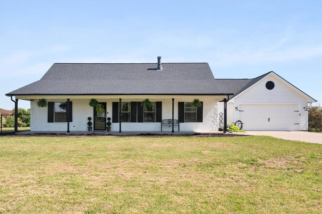 If you're looking for a little bit of the country close to the city, look no further, this one will check all of the boxes! It's cute, it's cozy, it's convenient, and it's peaceful living at its finest, all wrapped up into one.  This home has amazing curb appeal, with its farm-style design that is sitting on 1.5 acres. Get your riding lawnmower and come on! Take a tour of this super cute home that's perfect for any family. But before you do, pull up a rocking chair on the oversized front porch and shuck some peas. It has concrete-stained floors for easy cleanup and carpeted bedrooms for when those feet hit the floor.  It's an open concept with a large, light, and bright kitchen with crisp white cabinetry that has bar seating and a spacious kitchen nook that gets tons of natural light.  It has a split bedroom floor plan with the primary suite located on the opposite side of the home from the spacious secondary bedrooms.  The ideal gathering space in the family room with vaulted ceilings, a beautiful stone fireplace as the focal point. The driveway will accommodate up to 8 parked cars and more! It's great for entertaining family, friends, and neighbors. When you walk into the backyard, it is a paradise delight. Relax by sitting on the covered back porch, or sit by the pool that has multiple seating areas and a large covered patio. There really is no place like home, and this one is waiting for you to call it home!