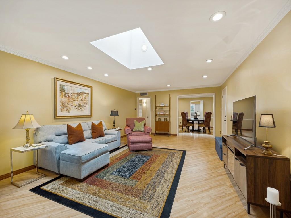 Welcome to one of Dallas' most desirable in-town locations—nestled *behind the Pink Wall* one of the city's most iconic and recognizable neighborhoods. Located in highly-desirable Preston Hollow, directly across from Preston Center and minutes from NorthPark Center where you will enjoy premier dining, shopping, and entertainment. This beautifully updated second-floor condo offers an unbeatable blend of convenience, charm, and carefree living. Spacious open living and dining areas are filled with natural light, a well-appointed kitchen with abundant cabinetry, granite countertops, and double ovens. The flexible floor plan features two generously sized primary bedrooms, two full baths, and a flexible floor plan making it ideal for everyday living. Use one bedroom for a home office-study, hobby room, or exercise room. The second-floor location provides added privacy with peaceful treetop views and no neighbors above. Two dedicated covered parking spaces are conveniently located just outside the private rear entrance. The beautifully maintained community is surrounded by mature trees, landscaped courtyards, and a sparkling pool, creating a peaceful retreat in the heart of the city. The HOA covers utilities, exterior maintenance, landscaping, pool maintenance, and more, allowing for truly low-maintenance living on the edge of the Highland Park and University Park. Whether you're looking for a primary residence, a lock-and-leave lifestyle, or a centrally located Dallas retreat, this exceptional Preston Hollow home places you just minutes from the Dallas North Tollway, US-75, Love Field, Downtown Dallas, and everything that makes living in the heart of Dallas so desirable. Nearby amenities include Love Field Airport, Dallas Country Club, Presbyterian Dallas Hospital, SMU, Highland Park Village. Area dining: R+D Kitchen, Sevy's, Hillstone, Hopdoddy. Private Schools nearby: Ursuiine, Winston School, St.Marks, Hockaday, Jesuit.
