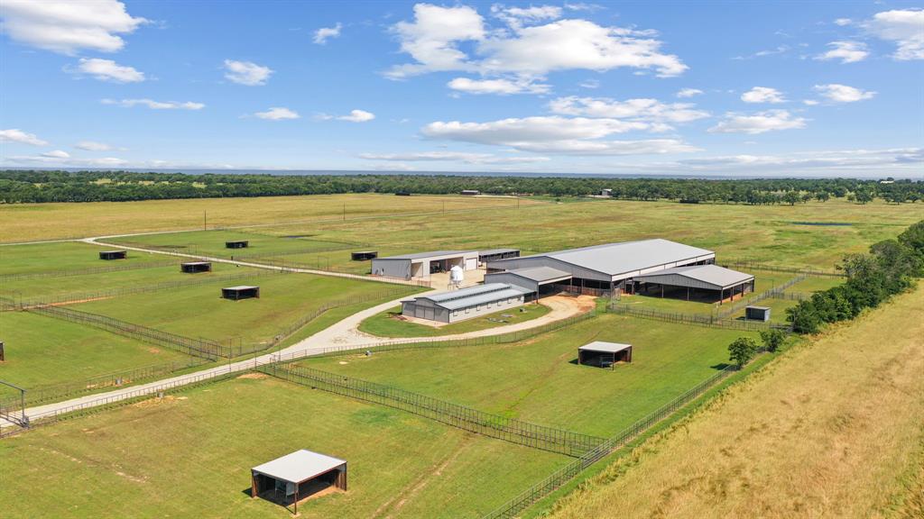Turn-key horse operation at its absolute finest. Situated on a sprawling 163 acre parcel of land, this property offers ample space and countless opportunities for your horses and farm production. Multiple pastures, fully fenced & crossfenced. 12-stall barn with automatic waterers, fans, fly-spray system, and matted stalls. Enclosed feed room & separate tack room. Covered breezeway from the barn to arena. 120x225 covered arena, with flag system & removable panels. Covered area with 6-horse Trojan walker. 8-traps with 20x12 horse sheds with water to all pens & separate alleyways. Main house has 3 bedrooms 2.5 bathrooms. Open concept. Covered patios wrap around. From pasture to pasture, every location is properly maintained and ready to be used immediately. Approximately 163 acres fenced for horses or cattle. Overall, this property is a true gem, offering unparalleled space, beauty, & horse amenities.  All the necessary tools and farm equipment needed to operate the ranch will convey.  It is sure to impress and offers all the space and amenities you need to succeed.