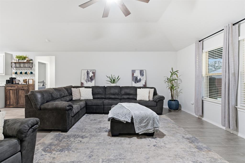 This 4-bedroom home sitting on a beautiful corner lot includes a dedicated office, 3 full bathrooms, and an open living area that connects seamlessly to a kitchen built for both cooking and gathering—complete with a large island and gas range.The extended covered patio offers extra room for outdoor dining and relaxation, while the 10×12 shed provides convenient storage for tools, equipment, or hobbies. You’ll also appreciate the fully insulated 2-car garage, adding year-round functionality.Located just minutes from schools, shopping, parks, and the lake, this home combines convenience with a thoughtful, practical design—making it a solid fit for a wide range of lifestyles.
