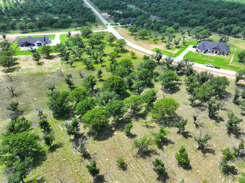 Beautiful 1.67 acre homesite located in The Landings, the newest and most desirable section of Pecan Plantation. This spacious lot offers a prime setting for your custom home with plenty of room for outdoor living, a pool, workshop, or extended driveway design. Enjoy the privacy of a larger tract while benefiting from all the amenities this premier gated community provides, including unlimited golf, 24-hour security, clubhouse facilities, marina, parks, walking trails, and on-site conveniences. Positioned near one of the community’s private airparks, this property combines luxury, lifestyle, and exceptional value in one of Granbury’s most sought-after neighborhoods.