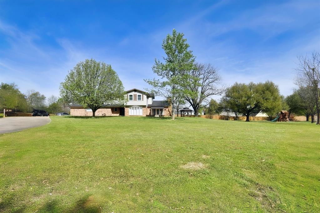 Sitting high on a hill in Winnsboro Tx, this 4,800 sqft home has had many upgrades and updates! This home is close to Winnsboro schools, downtown shopping, restaurants and hospital across the street. Home has 3 large bedrooms, 2 bathrooms and a half bathroom. Formal living and dining room combo being used as a double dining room, also a breakfast room next to kitchen. Huge family living room with wood burning fireplace and built-in bookshelves. Kitchen has center island and breakfast bar. Garage has been enclosed and finished out with 2 closets, perfect for a game room, man cave or an additional bedroom. Mud room next to kitchen with double sliding doors, open patio out front and a covered patio in back. This property has 1.69 acres, plenty of driveway parking, a gazebo with a swing and a kids playground set already in place. Home has fresh paint inside and out and new flooring within the past year. Located just 5 minutes to Lake Winnsboro Public Boat Ramp and 10 minutes to Legendatry Lake Fork Public Boat Ramp. Bring your best offer! Homes like this are becoming super rare! Schedule your showing today! Buyer to verify any and all information.