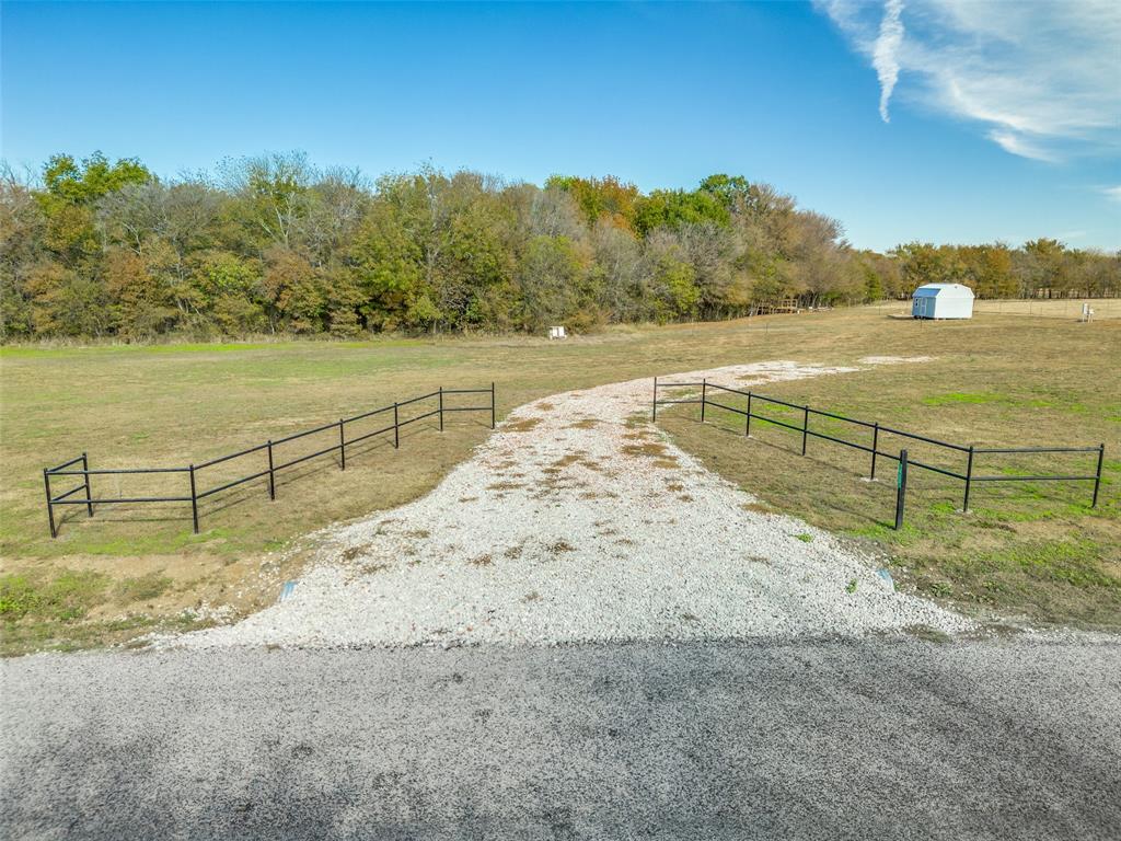 This 2 acre property is an absolute gem. The trees, creek, large pasture next door will keep your place quiet and private. Water and electricity are already run which will literally save you thousands when it's time to build! Storm shelter is built in and new storage shed can stay or go! Enjoy the freedom of designing and building the home you need and want in this cute small town of Collinsville, TX!