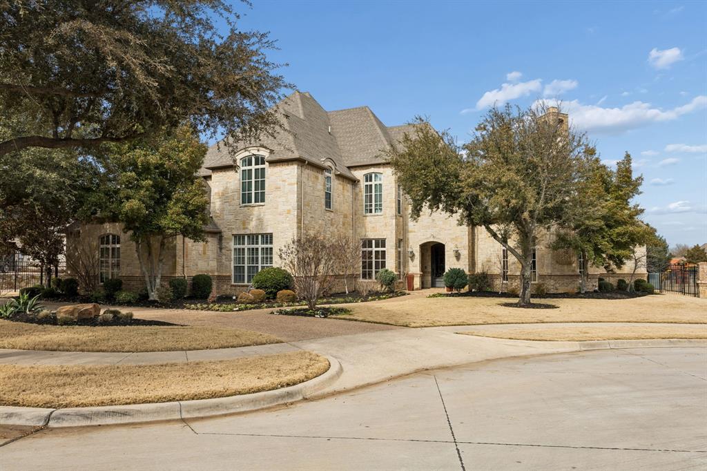 Located in Southlake’s highly sought-after Estes Park community. This stunning 6-bedroom, 8-bath estate offers 7,004 square feet of refined living on a quiet cul-de-sac with exceptional privacy. Situated on just over half an acre, the home backs and sides to HOA-owned green space providing endless space to get outside with the family, creating a rare, peaceful setting. Recently updated throughout, including a beautifully refreshed primary retreat and spa-like primary bath, along with updated downstairs living areas and kitchen.The primary suite and an additional guest suite downstairs with four bedrooms up. Located in award-winning Carroll ISD, this is a prime opportunity in one of Southlake’s most desirable neighborhoods.