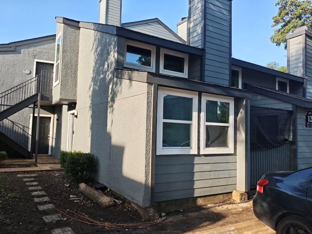 Two-story condominium featuring a unique loft layout with two bedrooms and two bathrooms. The primary bedroom is located on the second level for added privacy. Unit flooring consists of carpet, ceramic tile, and vinyl. The first floor includes a spacious living area, an open-concept second bedroom, and a separate enclosed kitchen. The kitchen features partial updates completed in March 2026, including newly installed ceramic tile flooring. A well-working Samsung washer is included with the property. There is a dryer, but it is not connected. The king-bed and desk purchased in 2025 will also be transferred to the new owner at no additional cost.