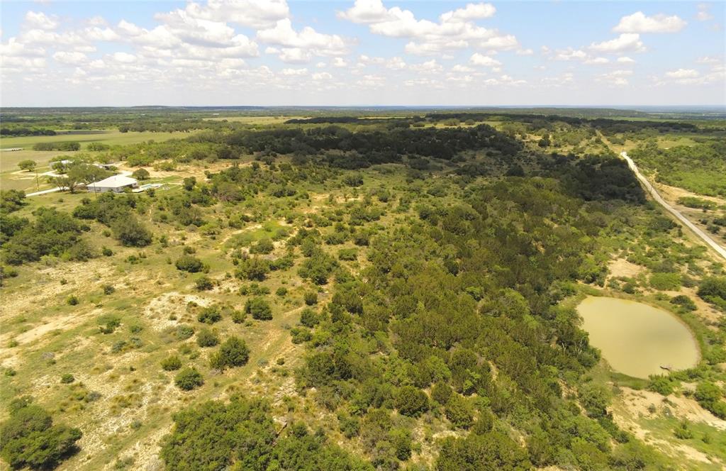 What are incredible views worth? We don't know, but this place has them right off the back porch! See the sun rise in the morning and be in the shade in the evening! Simply a breath-taking view of Deep Creek Valley. This 319 acre combination game and cattle ranch is high fenced with low cross fencing. All in excellent condition. There is little mesquite, prickly-pear cactus, or cedar. Most of the approximately 126 acres of open grazing land can be closed off from the timbered areas during hunting season. There are four stock ponds.   Thick brush and large Live Oaks predominate the rest of the property. The home was built in 2000 and has 2090* square feet under central heat and air. It features two bedrooms and two baths with walk-in closets. The kitchen is semi-open to the living room and is equipped with granite counter tops, double ovens, and all the amenities you would expect including a dining area, breakfast area, large walk-in pantry, and a utility room with washer, dryer, and water softener. Ceiling fans though out. Tile in living, kitchen, and utility. Wood laminate in bedrooms and baths. No updating is needed. It is move in ready.  Additionally, there is an 816*square foot guest house that was built in the 1940’s. It features a full kitchen, two bedrooms, a bath, all under central heat and air. 
Also present on the property is a 2000 square foot metal barn with concrete floors, skylights, fluorescent lights, and sliding doors north and south. A good set of cattle working pens with a shelter shed, a chicken coop, multiple water troughs, 250-gallon propane tank, 500-gallon fuel tank, and Fiber Optic internet! A beautiful, well taken care of property in a very quiet area. 

*As per McCulloch CAD