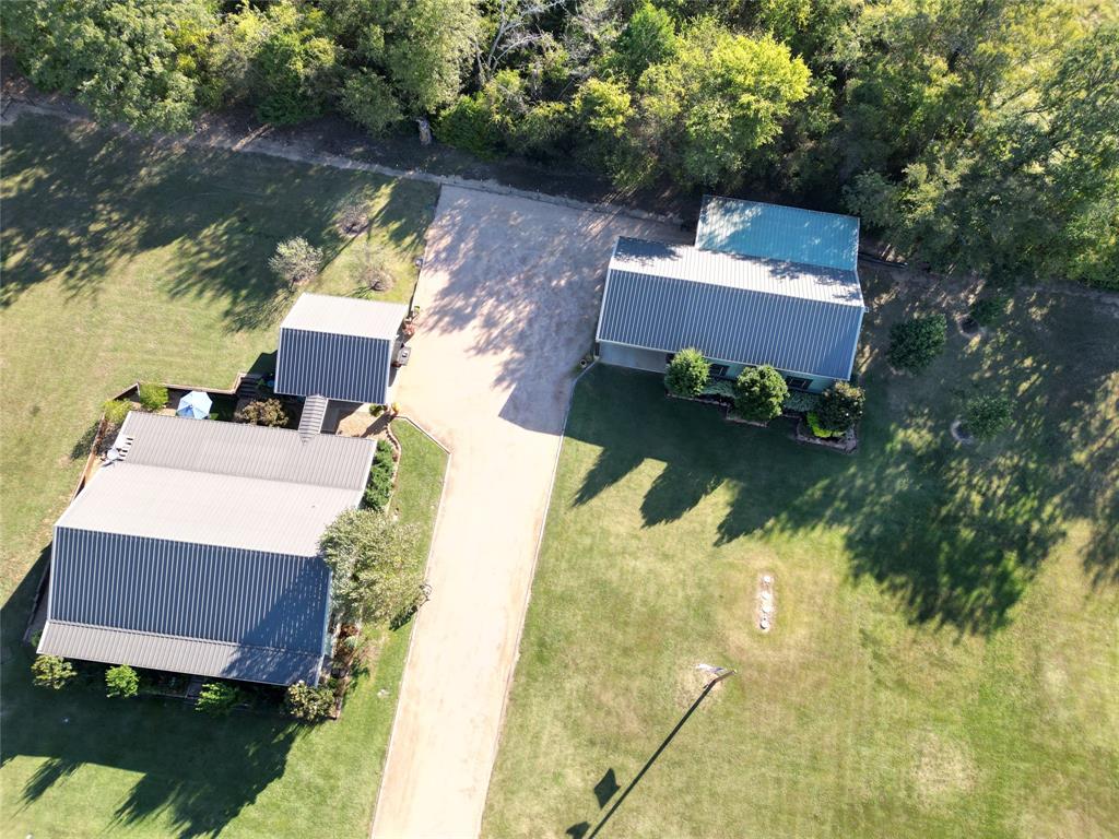 This home is a beautifully, professional landscaped home (not your typical home) with many unique features and LOTS of closet and storage area. A two car detached carport connected by a breezeway. Across the driveway is a 2600 sq. ft. shop with a covered three car carport attached to the front of the 14 ft. shop door. Shop also has an additional side entry door and a full bathroom with shower.