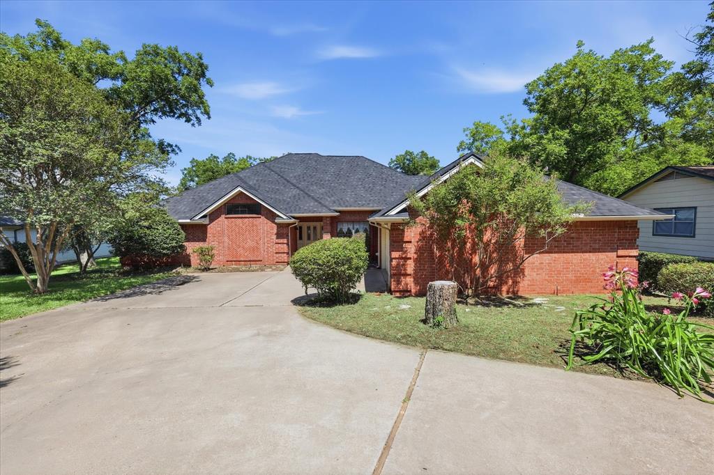 Don't miss this opportunity to own a home in the gated DeCordova Bend Estates community. This 2,105-square-foot home offers 3 bedrooms, 2.5 baths, and a desirable split-bedroom floor plan. Built in 1992, the home features an open living and dining layout designed for everyday living and entertaining. The living area includes a wet bar, while the primary suite offers an adjoining office or flex space. A half bath is conveniently located off the utility room near the garage entry. Enjoy year-round outdoor living from the spacious screened porch overlooking the backyard, along with an additional patio area for relaxing or entertaining. The golf cart garage provides added storage and easy access to community amenities. DeCordova Bend Estates offers 27 holes of golf, Lake Granbury access, marina, boat ramps, clubhouse, fitness center, swimming pool, tennis and pickleball courts, and more. Conveniently located near shopping, dining, and medical facilities.
