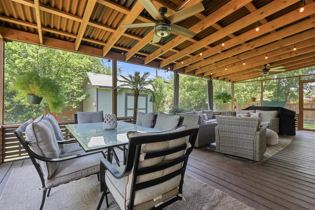 Experience the ultimate indoor-outdoor living in this beautifully updated Benbrook home! The true showstopper is a bonus 450 SF screened-in outdoor living oasis complete with a 30x15 deck, bar with built-in ice bin, mini-fridge, TV, cooking, dining and lounge space with decorative lighting and lush greenery—perfect for year round entertaining. Step through the beautiful French doors back inside to the fully renovated kitchen and dining room with custom built-ins and coffee bar. Sit by the firepit for smores while watching a game or movie in your outdoor entertaining oasis! The GRAND backyard also features a dog run. Perfect for dog lovers! This BEAUTIFUL 3 bed, 2 bath UPDATED home is MOVE-IN READY and located in the amazing Mary's Creek Neighborhood! The updates include, but are not limited to, a bathroom renovation, a new roof (2026), new flooring, and custom built-in cabinetry throughout! Not only does this house have perfect flow and a porch with bonus square footage, it's also conveniently located near restaurants, parks, and the highway. Come see it today, it won't last long!