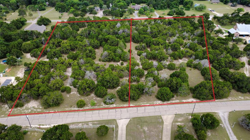 Discover the perfect blend of privacy, comfort, and convenience at the scenic hills of Cedar Hill. Nestled on a spacious, tree-filled lot, this property offers a peaceful country-style setting while remaining just minutes from major shopping, dining, entertainment, and commuter routes. Surrounded by mature trees and rolling terrain, the area is known for its natural beauty and upscale custom-home feel that makes Cedar Hill one of the most desirable communities in southern DFW. This home is conveniently located near Joe Pool Lake, Cedar Hill State Park, and local hiking and biking trails, offering endless opportunities for outdoor recreation, boating, fishing, and weekend entertainment. Enjoy easy access to Hwy 67 for commuting to Dallas, Mansfield, Midlothian, and surrounding areas. This is a 2.4-acre Residential Lot sold as a bundle with a similar lot next to this one located at 440 Evergreen Trl MLS #21276685